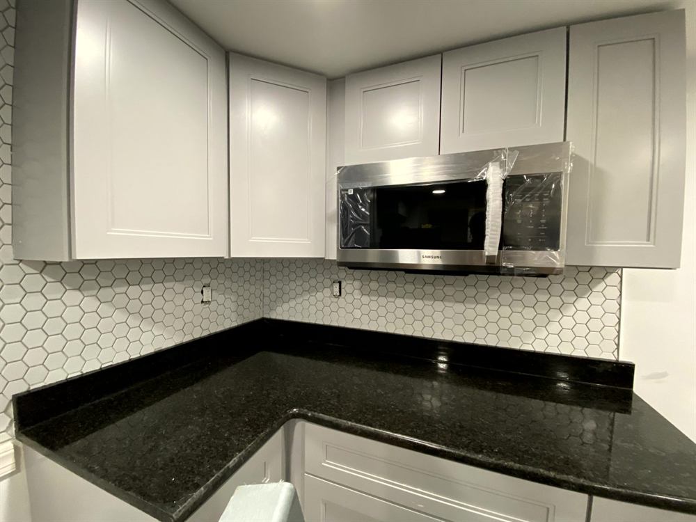 geometric mosaic tile backsplash in modern Philadelphia kitchen